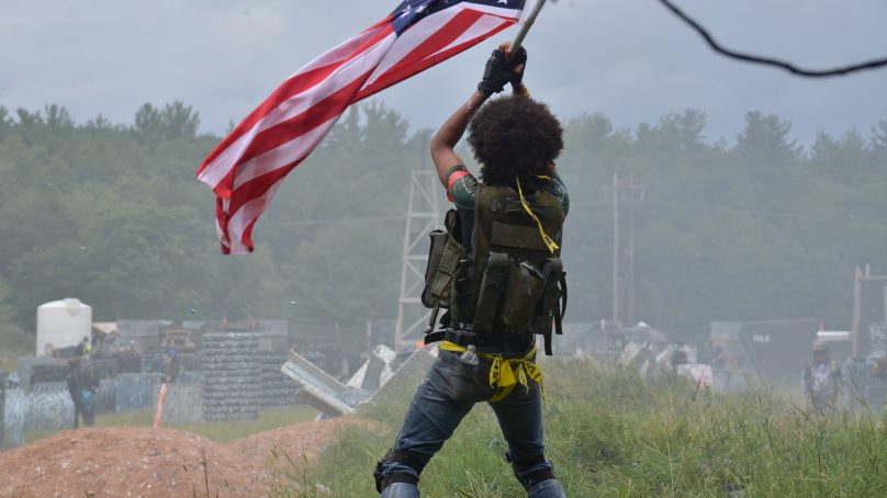 American Flag Holder for the Allied Army at the Invasion of Normandy Scenario Game at Skirmish Paintball