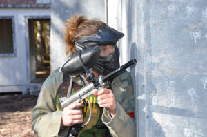 Female paintball player playing paintball at Skirmish paintball in Jim Thorpe, PA