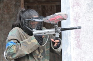 Lady playing paintball at Skirmish Paintball